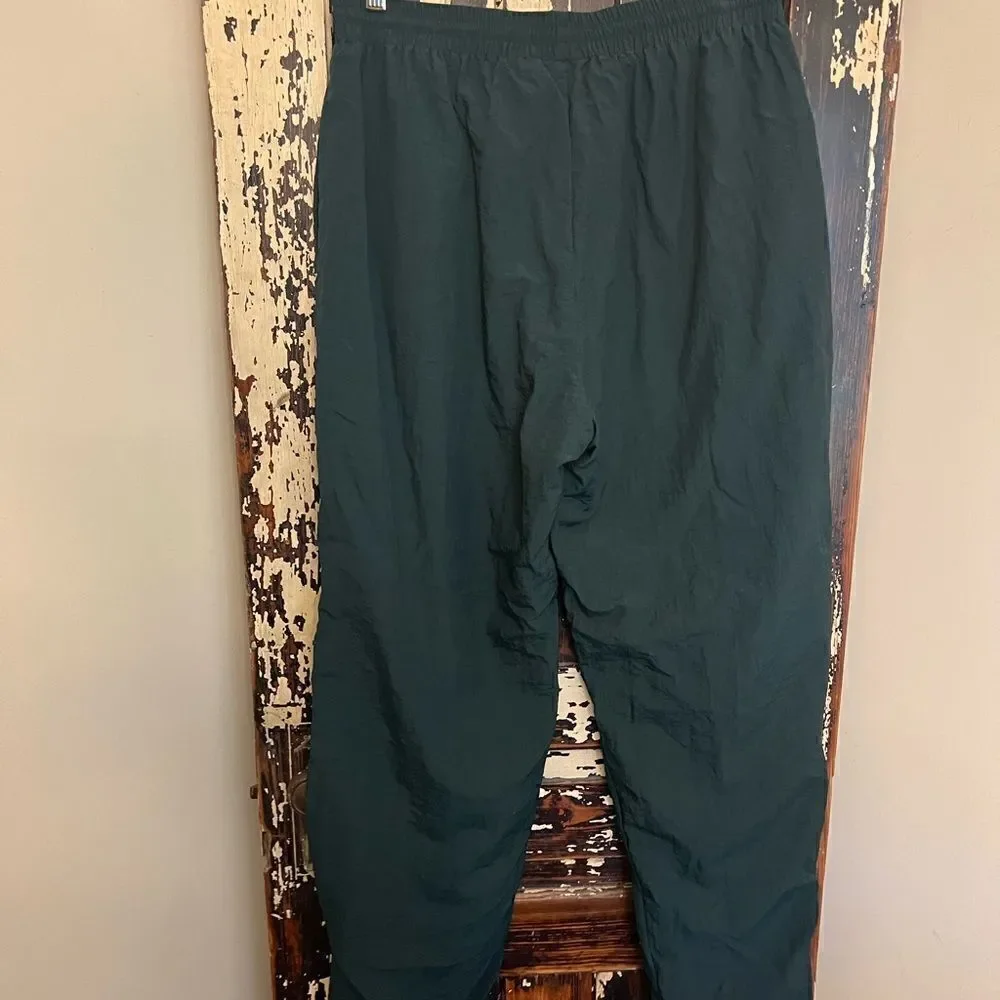 Men’s Vintage Reebok Nylon ankle zip track pants.